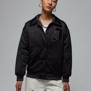 Jordan women’s varsity bomber black jacket. NWOT size M